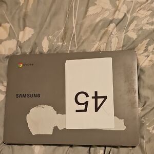 Samsung Silver Laptop with Chrome Logo